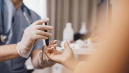 Doctor taking a patient's blood sample in a clinic