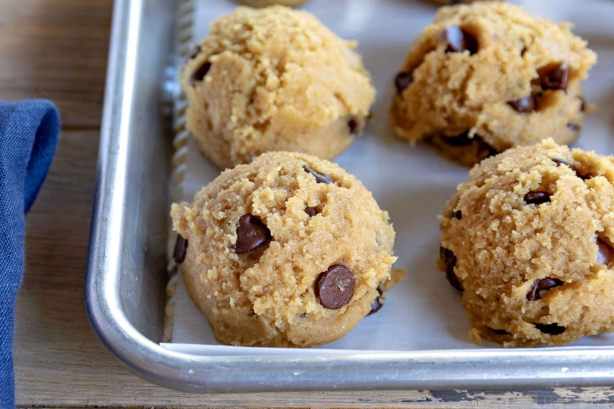 chewy chocolate chip cookies dough scooped onto baking sheet