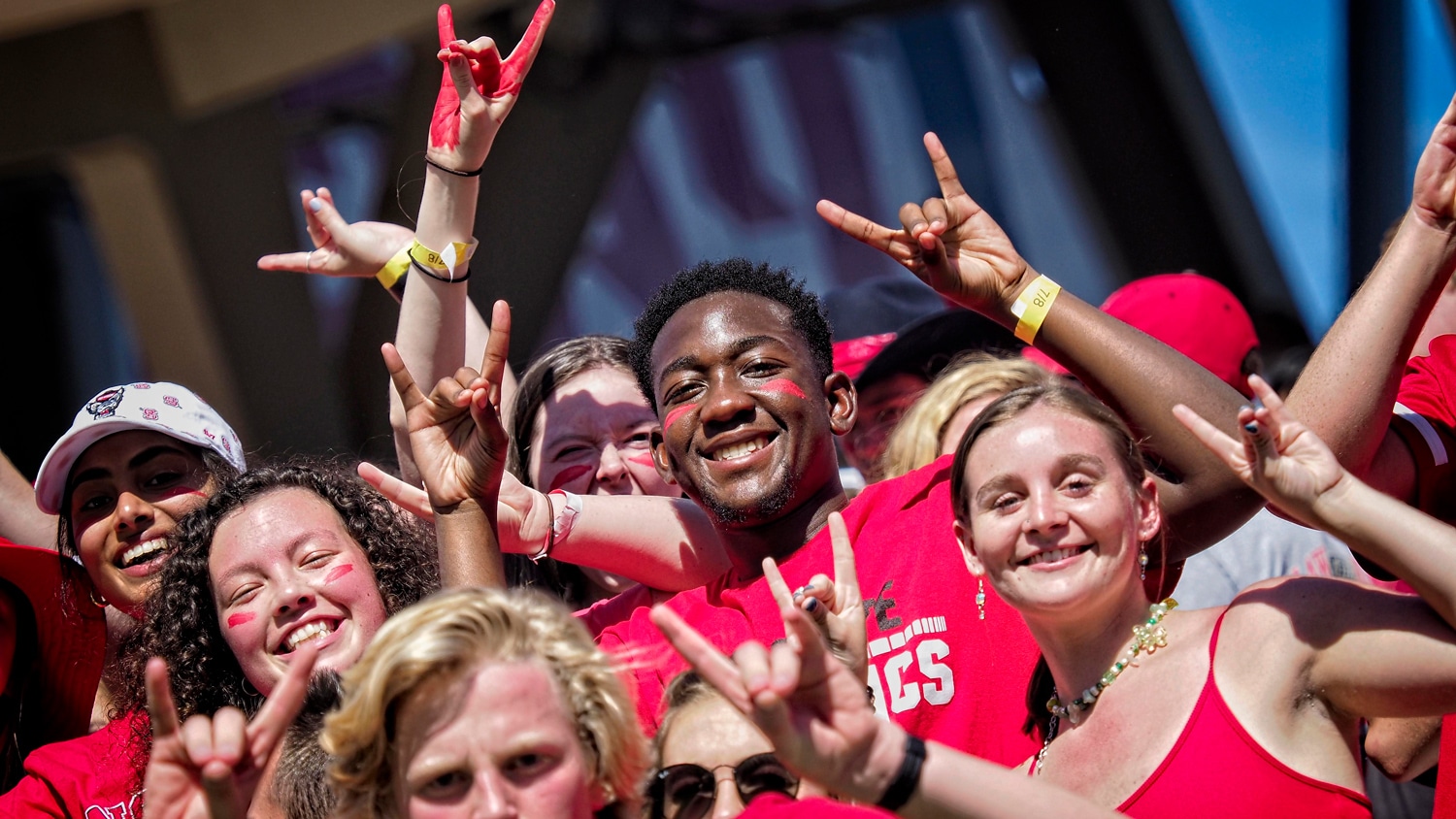 NC State student fans cheer on the Wolfpack during their overtime win over Clemson in 2021.