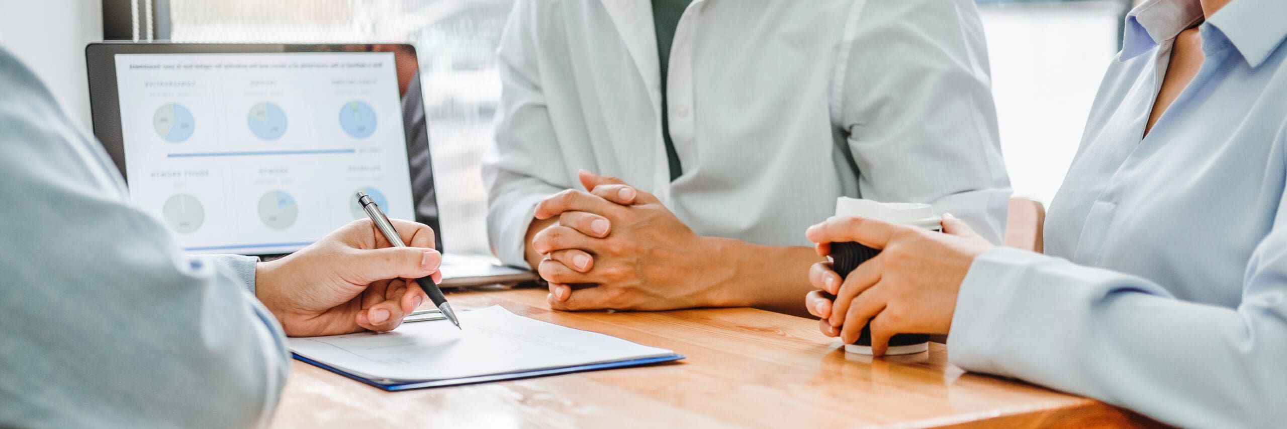 Young couple and real estate Financial Advising agent using laptop on a meeting about Accounting Calculating Cost Economic bills Financial concept