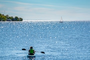 A kayaker heads out onto a sparkling Lake Ontario from Sackets Harbor. Kathe Harrington | NYUp.com