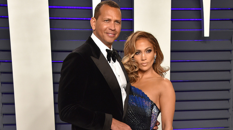 Alex Rodriguez and Jennifer Lopez posing