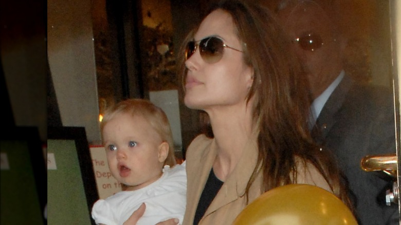 Angelina Jolie holding Shiloh Jolie-Pitt