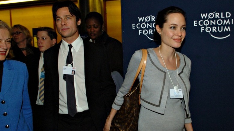 Brad Pitt and Angelina Jolie holding hands
