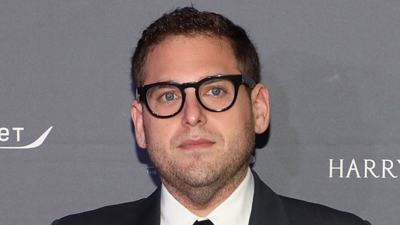 Jonah Hill wearing glasses on red carpet