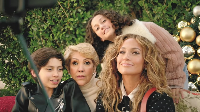 Max, Guadalupe Rodríguez, Emme, and Jennifer Lopez posing together