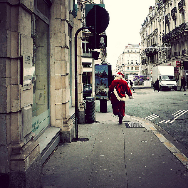 Santa running down the street in Algers, France