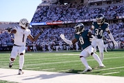 Eagles safety C.J. Gardner-Johnson (8) holds the ball after intercepting a pass intended for Cincinnati Bengals wide receiver Ja'Marr Chase.