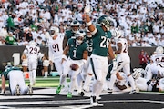 Eagles quarterback Jalen Hurts (1) celebrates a 1-yard touchdown, completing a fourth quarter drive that showed the offense's identity.