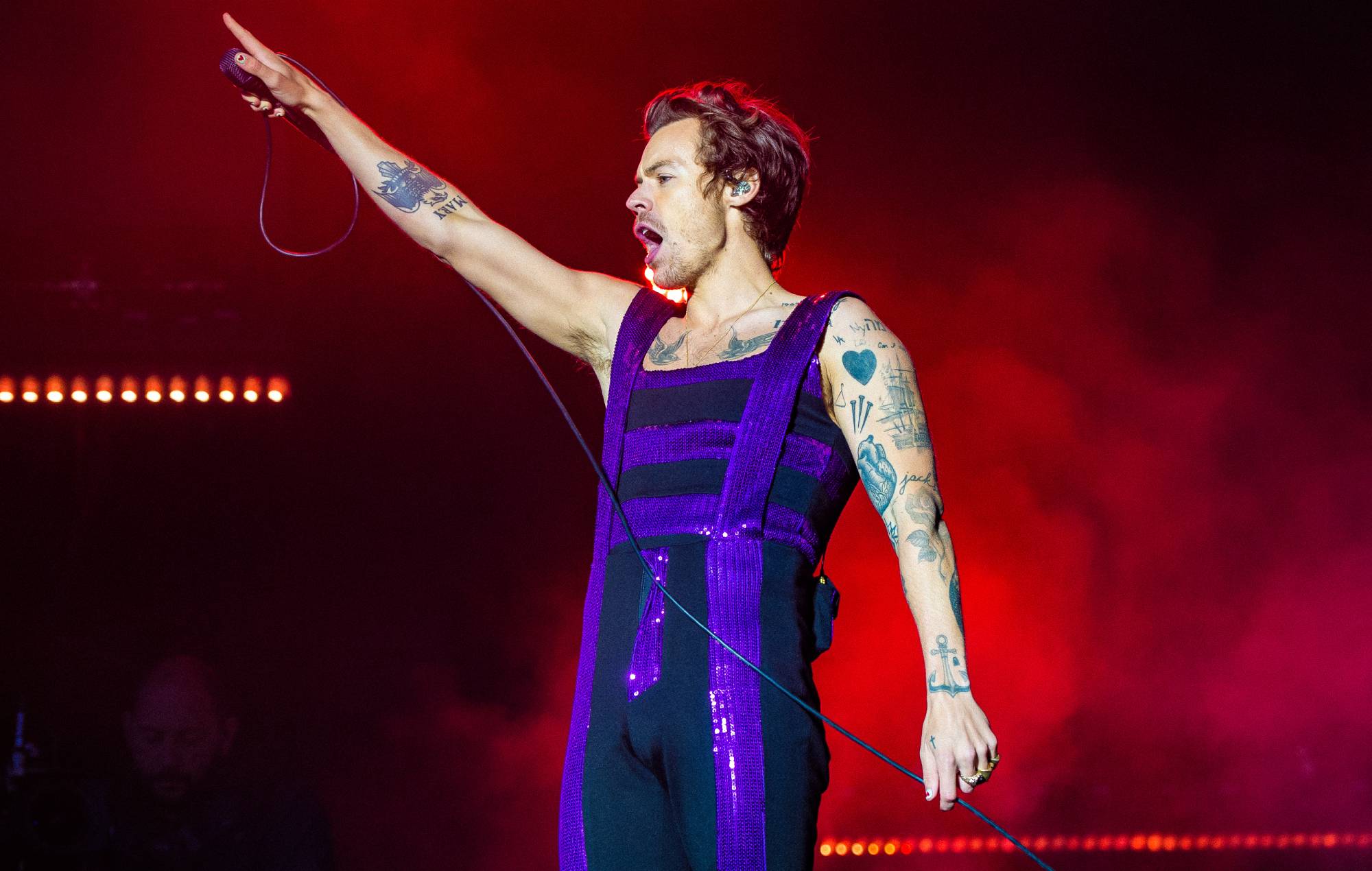 Harry Styles performing live on-stage in 2022