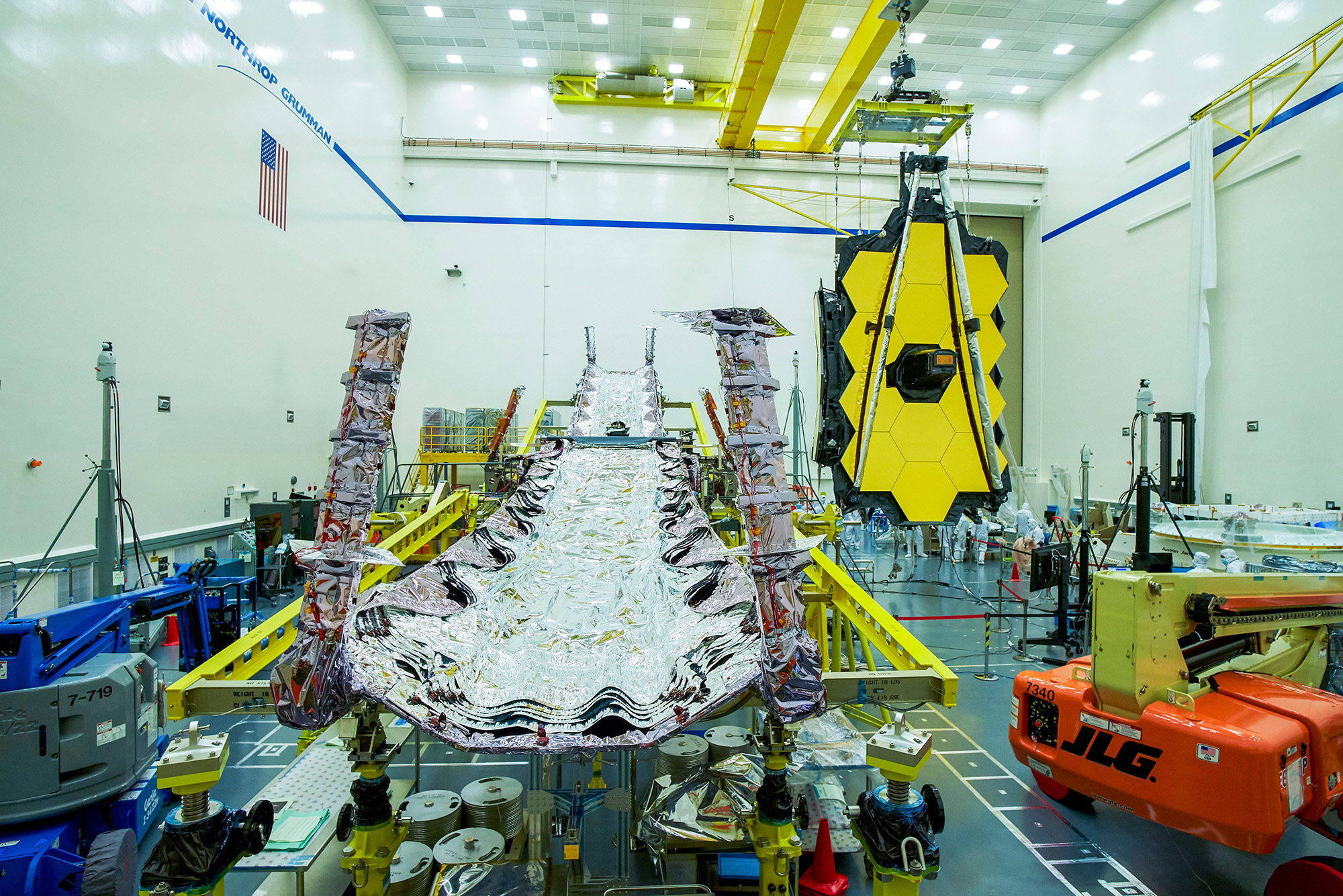 clean room with telescope being worked on by technicians