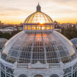 aerial shot of the Enid. A. Haupt Conservatory at sunset