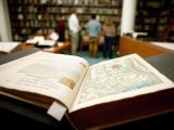 Close up of open book in Library.