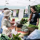 Guests buying produce at the Farmers Market