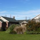 The exterior of the property, showing the converted church to the left, and a 2006 extension to...