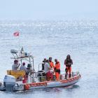 Italian emergency services headed out to sea towards the area off the Sicilian coast on Tuesday,...