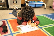 A student at Terra Linda Elementary School inBeaverton works on the carpet in their classroom. The district's leaders have requested that a state mediator help them in their labor negotiations with the Beaverton Education Association.