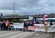 Protesters blockaded southbound lanes of Interstate 5 in Eugene about 10 a.m. April 15, 2024.