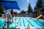 People swim in Peninsula Outdoor Pool at Peninsula Park in NE Portland the morning of Tues., July 9, 2024, as a record heat wave continues in the city.