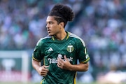 Portland Timbers midfielder Evander (#10) heads to the corner for a corner kick during an MLS match against the San Jose Earthquakes at Providence Park in Portland, Oregon on Wednesday, May 15, 2024.