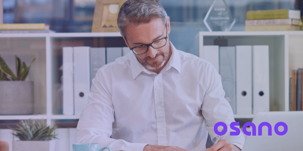 Man at Work Behind Desk