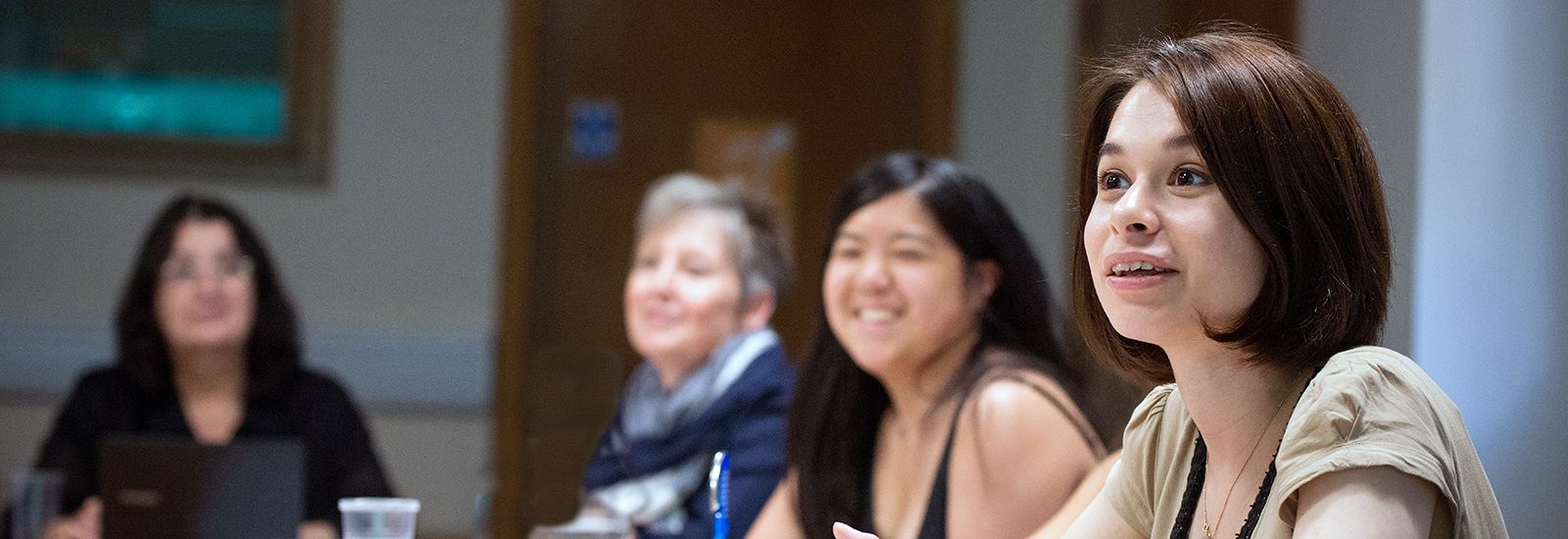 Four students talking in a seminar