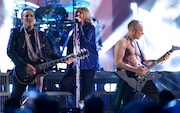 Inductees Vivian Campbell, from left, Joe Elliott and Phil Collen, of Def Leppard, perform at the Rock & Roll Hall of Fame induction ceremony at the Barclays Center on Friday, March 29, 2019, in New York. (Photo by Evan Agostini/Invision/AP)