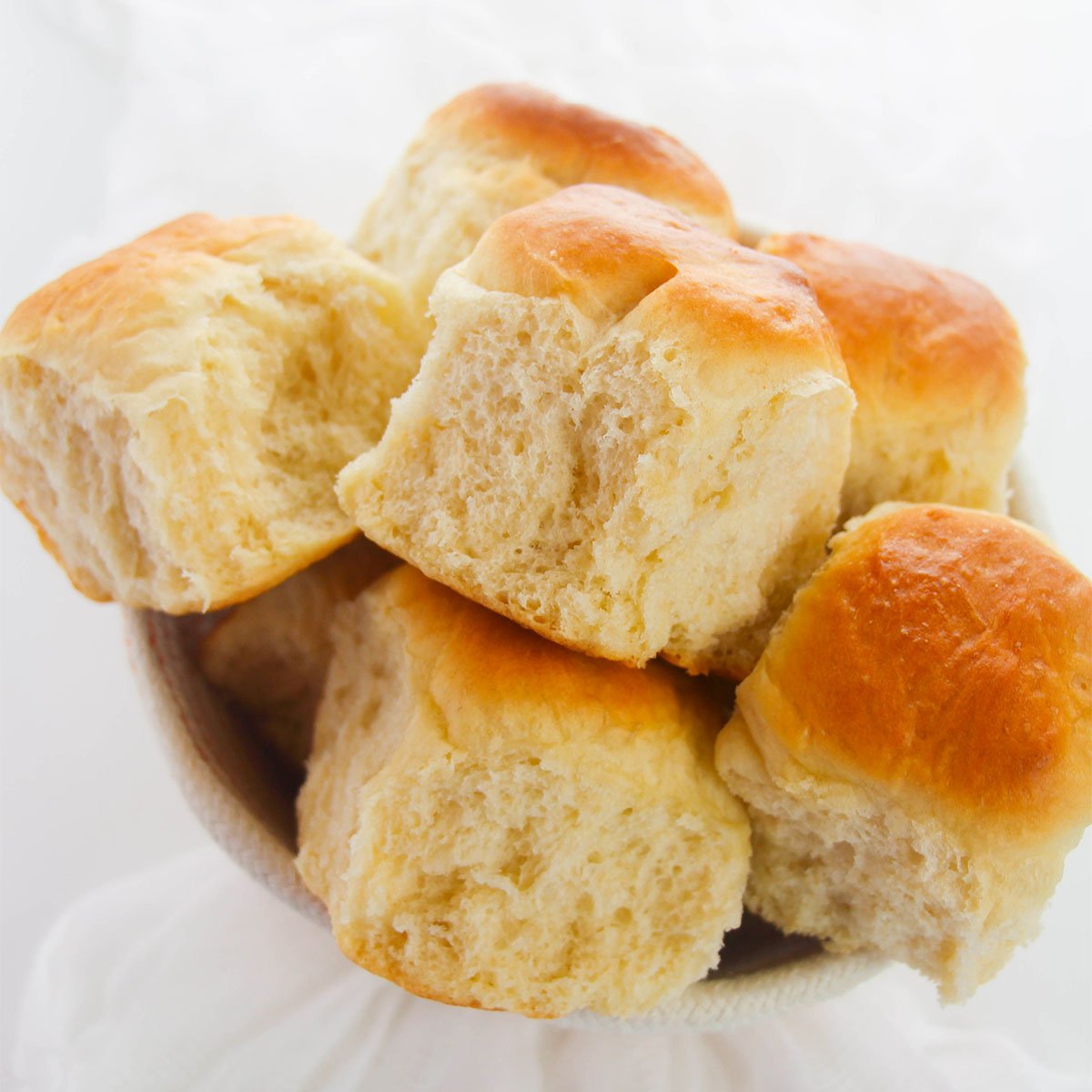 several dinner rolls in a bowl from above