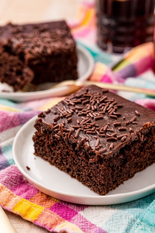 slice of chocolate dr pepper cake on a white plate