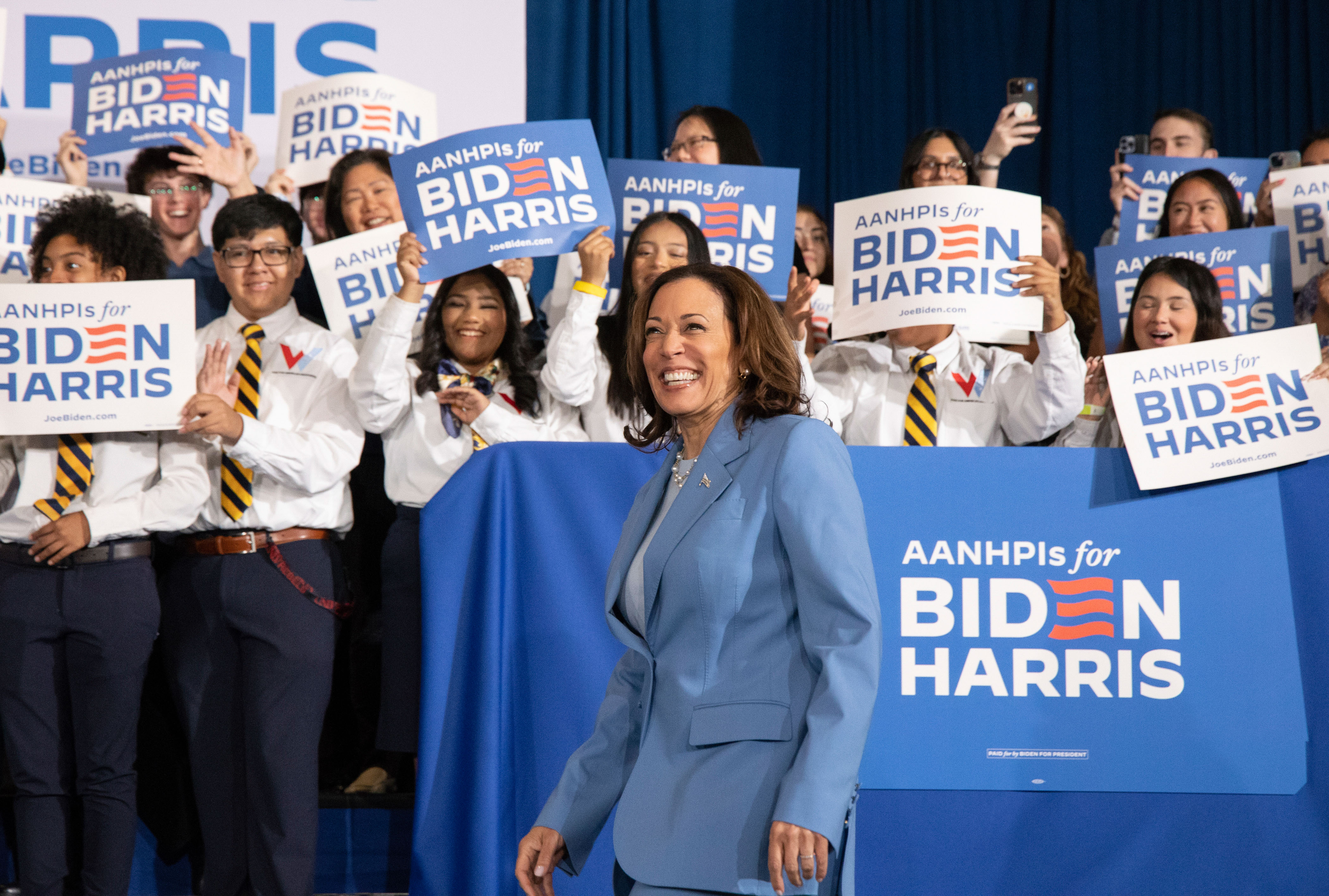 Vice President Kamala Harris takes the stage prior to speaking to supporters.