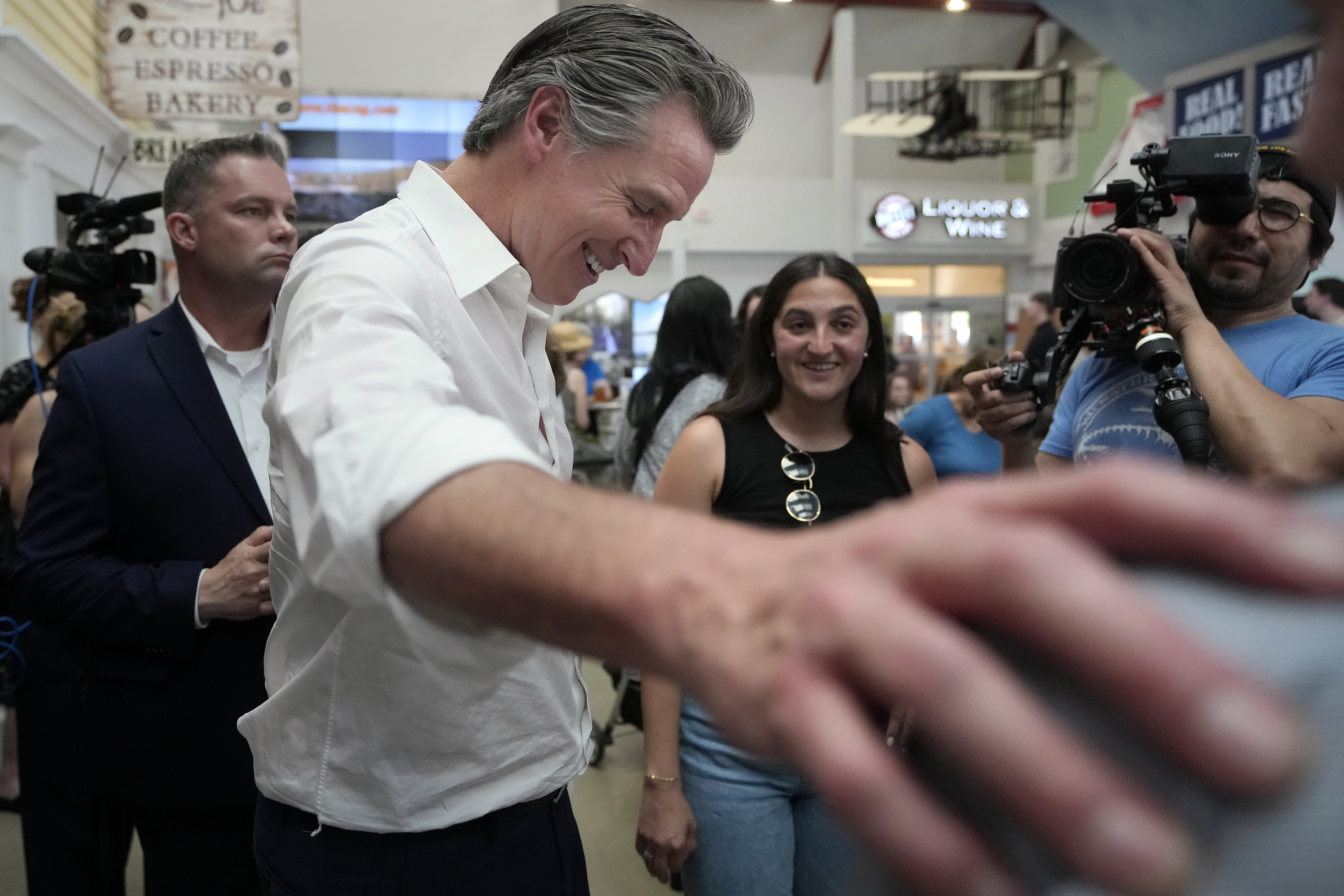 California Gov. Gavin Newsom greets people.