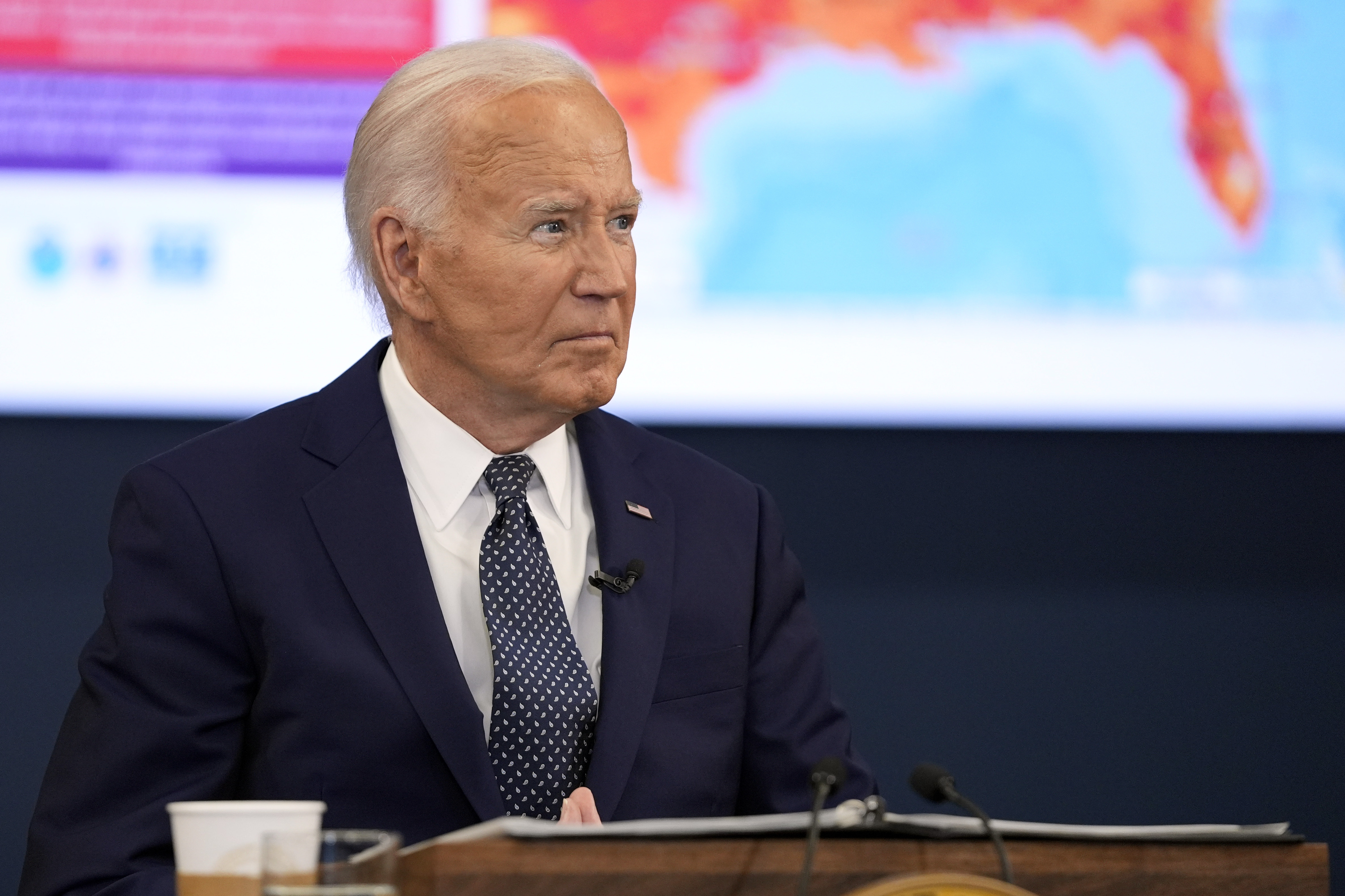 President Joe Biden listens.