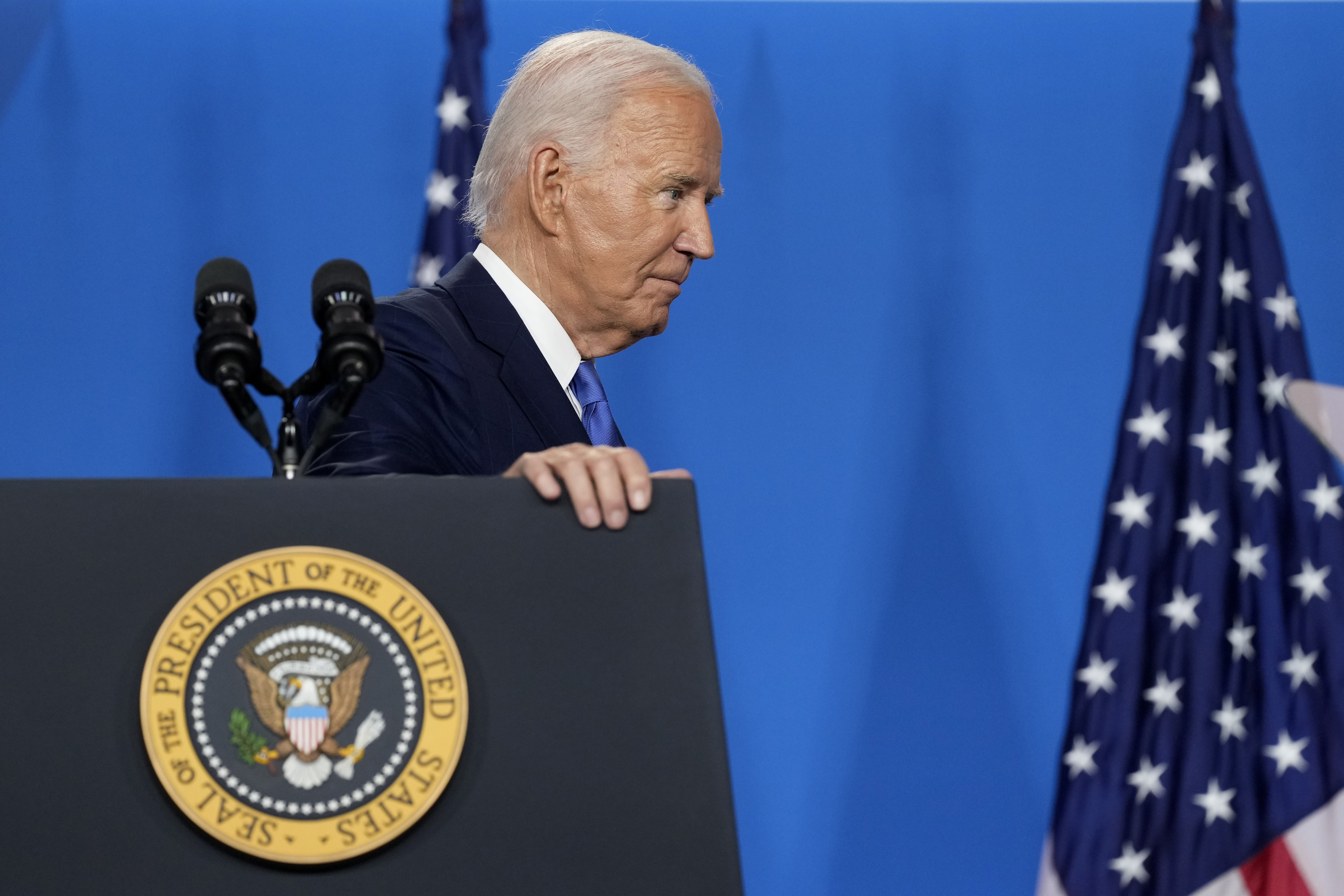 President Joe Biden departs after speaking at a news conference.