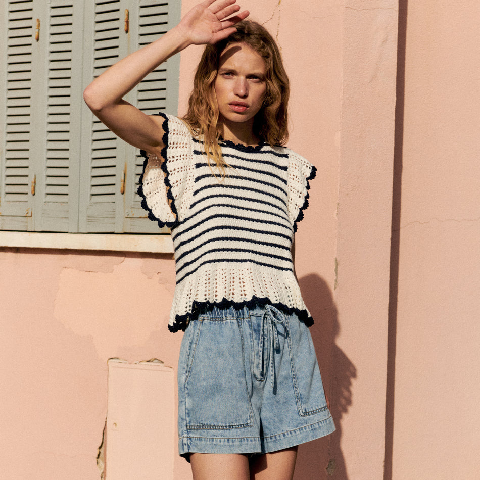 FRONT EDITORIAL IMAGE OF MODEL WEARING COEN TOP AND FOSTER SHORTS