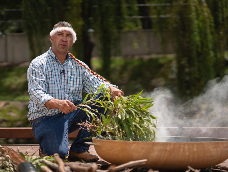 Paul House with gum leaves and smoke