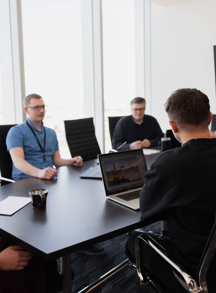 Utah office photo showing team members collaborating in an SEO and PPC reset strategy meeting.