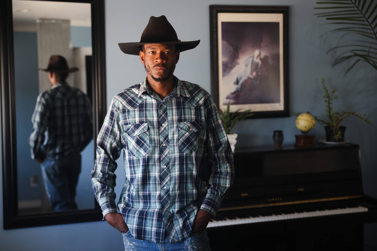 Local resident Burgess Houston III poses for a portrait in his home in the Windsor Park neighbo ...