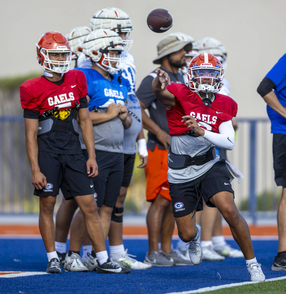 Bishop Gorman quarterback Melvin Spicer IV (#2) tosses an out pass during football practice on ...