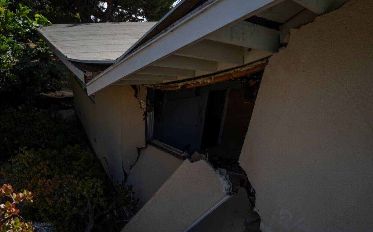 A home severely damaged by ongoing landslides is seen in Rancho Palos Verdes, Calif., Tuesday, ...