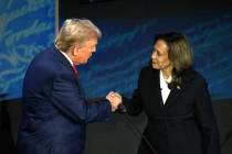 US Vice President and Democratic presidential candidate Kamala Harris (R) shakes hands with for ...