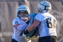 Raiders guard Jackson Powers-Johnson (70) and guard Clark Barrington (64) on a drill during pra ...