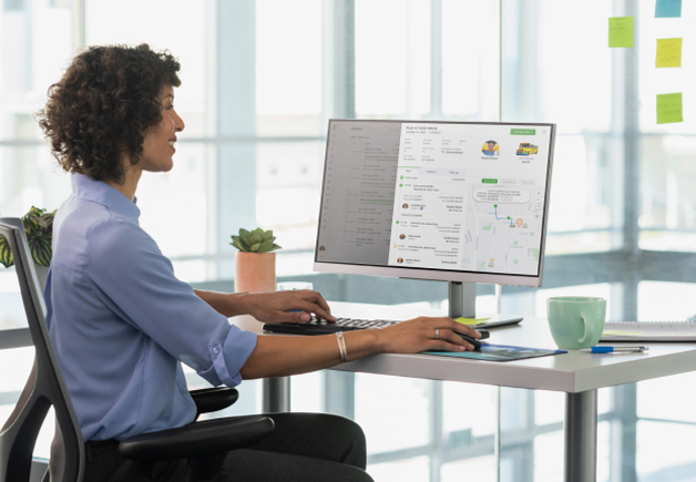 Woman sitting at a computer desk