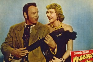 Mississippi Rhythm, US lobbycard, from Left: Jimmie Davis, Veda Ann Borg, 1949. (Photo by LMPC via Getty Images)