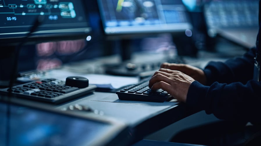 Hands typing on a keyboard