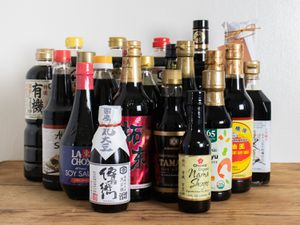 Collection of different types of soy sauces on a table