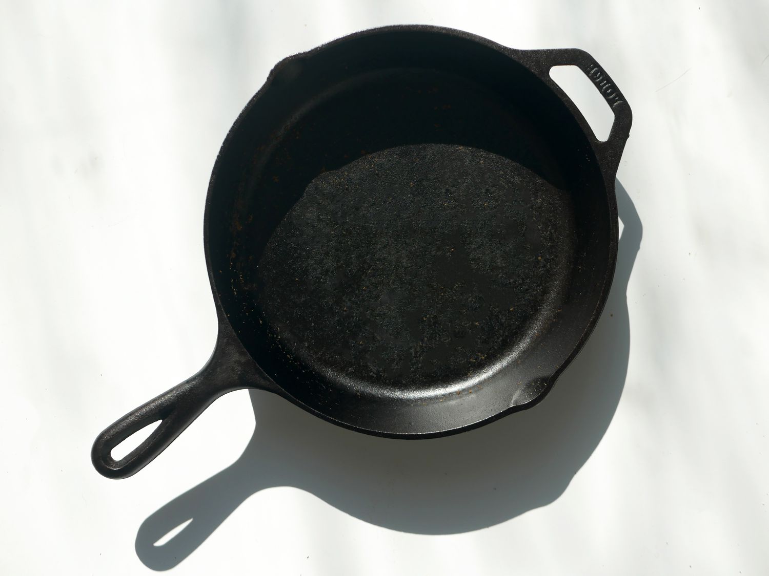 Lodge cast iron skillet on a white surface