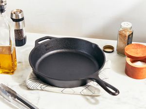 a cast iron skillet on a marble surface