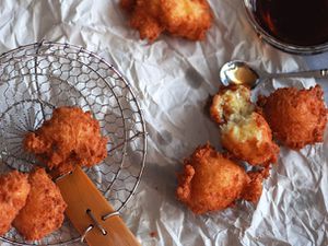 Closeup of Buñuelos de Yuca y Queso (Yuca and Cheese Fritters), fresh from the fryer.