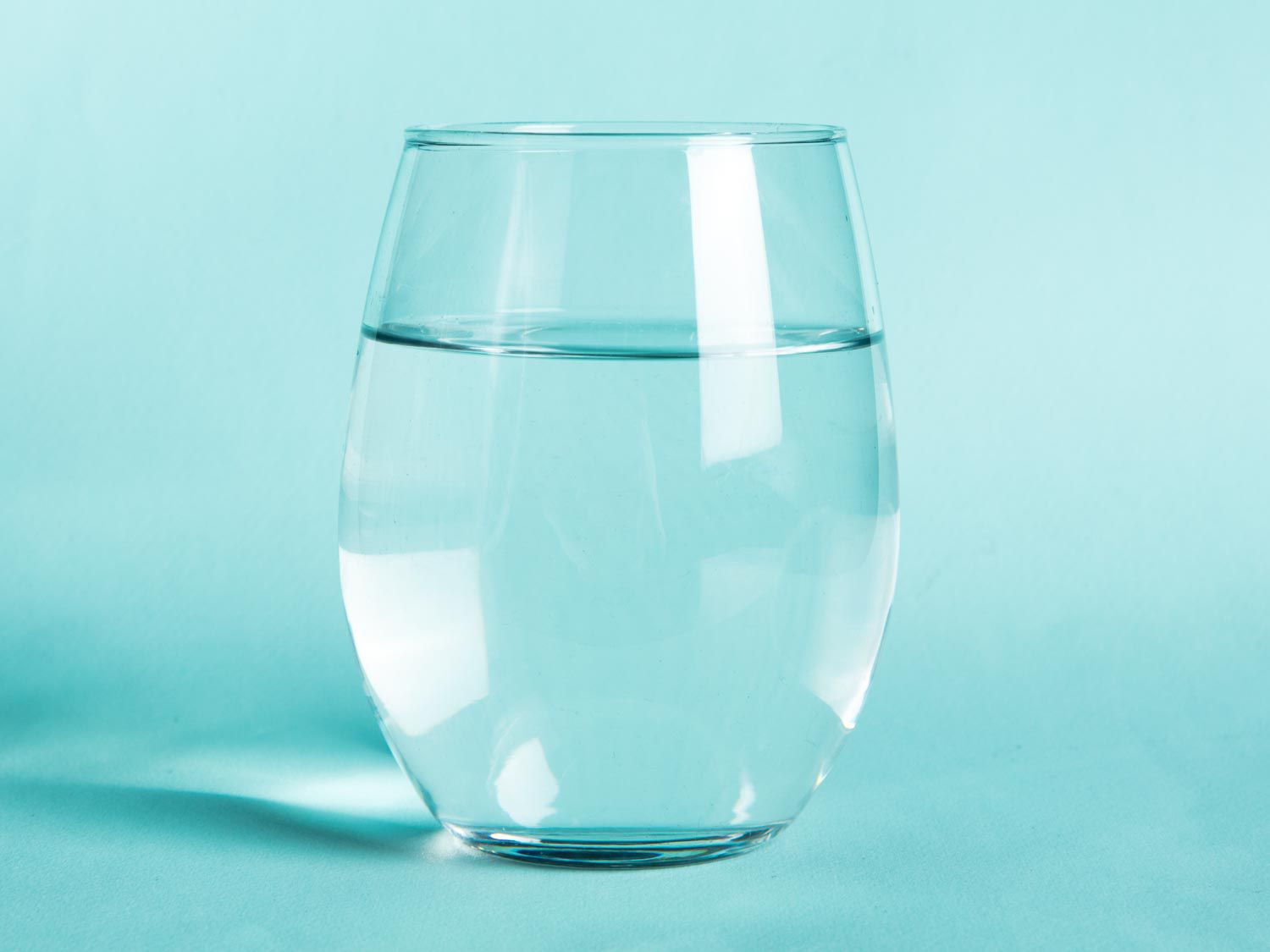 A stemless wine glass full of water.