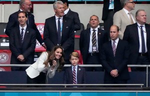 Prince William, his son Prince George and Duchess Catherine, from right, stand on the tribune prior the Euro 2020 soccer championship final between England and Italy at Wembley stadium in London, Sunday, July 11, 2021. (AP Photo/Frank Augstein, Pool)